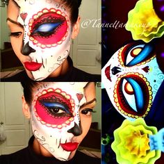 the woman is wearing a colorful mask and has her face painted like a kiss on it