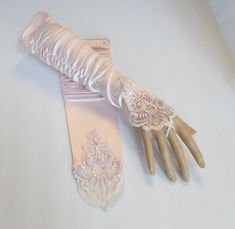 "Beautiful Formal Gloves Pink Fingerless Gloves with Beaded Lace Rouched Stretchy satin / polyester blended fabric One size fit most (S-XL) Regular women's size DESCRIPTION: These are gorgeous gloves done in all satin with embroidery, beads and sequins. They are rouched at the ends (upper arm portion). There is a loop that goes around the middle finger. MEASUREMENTS: ONE SIZE/Misses Regular Color: Pink Material: satin / polyester blended fabric + Lace Size: 14\" inches Pink Satin Gloves w/ Beads Pink Satin Gloves, Aesthetic Gloves, Pink Fingerless Gloves, Princess Gloves, Fancy Gloves, Gloves Aesthetic, Satin Gloves, Saloon Girls, Embroidery Beads