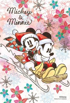 mickey and minnie on sled with snowflakes in the background for disney christmas cards