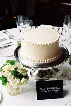 a white cake sitting on top of a table