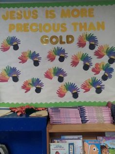 a bulletin board with the words jesus is more precious than gold on it in front of a bookshelf