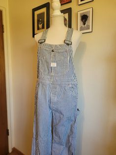 Vintage 1960's authentic Big Mac overalls are white with a vertical blue conductor stripe. Features several multi use pockets are on the front chest, button fly, two front waist pockets, two large back pockets, two pockets on the side of the right leg,  and hammer hook on the left leg. Adjustable overall straps. Union Made. 100% cotton. In excellent condition! These overalls have only slight light brown mark on the right overall strap (see picture). Priced for condition. Size Estimate M (waist 34") Overalls Costume, Overall Straps, Striped Overalls, Overalls Outfit, Bib Overalls, Big Mac, Union Made, Bibs, Striped Shirt