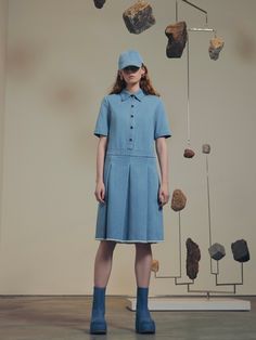 Building upon a successful series of polo-collared silhouettes, this Pre Fall 23 dress is crafted in the season’s garment-washed mid-weight denim. Designed with a relaxed fit, the drop waist silhouette gives way to wide box pleats and a frayed hem for a casual sensibility. Rosetta Getty's 10oz denim is mid-weight with a vintage feel. Offering season-spanning wear, the fabric features in styles that have been garment-washed for an inherent sense of ease. Spread collar Short sleeves Front button p Pre Fall 2023, Pleated Denim, Button Fashion, Fall 23, Box Pleat Skirt, Rosetta Getty, Dresses Casual Fall, Dress Shirt Sleeves, Pleated Maxi Dress