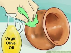 a person using an olive oil dispenser to clean a vase with the words virgin olive oil on it