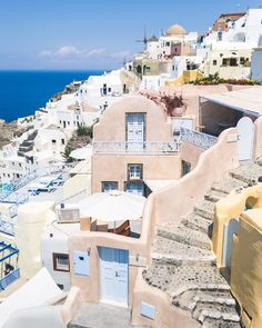 an aerial view of some buildings and the ocean