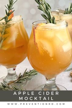 two glasses filled with apple cider cocktail