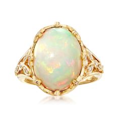 Ross-Simons - Ethiopian Opal, .28ct t. w. Diamond Ring Oval Cut in 14kt Yellow Gold. Size 6. Feast your eyes on this unique ring! A smooth 12x16mm oval cabochon of Ethiopian opal looks luminous in polished 14kt yellow gold. The fancy setting sparkles with .28 ct. t. w. round brilliant-cut diamonds, further adding to the beauty of the piece. 3/4" wide. Diamond and Ethiopian opal ring. Opal birthstones are the perfect gift for October birthdays. Diamond Ring Oval, October Birthdays, Antique Rings Victorian, Opal Birthstone, Ethiopian Opal Ring, Types Of Opals, Ring Opal, Pink Sapphire Ring, Diamond Solitaire Necklace