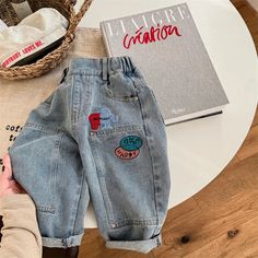 👖 Cartoon Fun Meets Denim Cool! 👖 These Kids Cartoon Patched Denim Pants are the ultimate playtime essential for your little adventurer! With a comfy loose fit, elastic waist, and adorable cartoon patches, these pants are made for fun. Your little one will love exploring, crawling, and climbing in these durable denim pants, perfect for spring and fall adventures. Plus, the handy pockets are perfect for storing treasures and the elastic waist makes getting dressed a breeze! Get ready for endles Fall Adventures, Patched Denim, Cartoon Fun, Adorable Cartoon, Kids Cartoon, Denim Patches, Romper Outfit, Girls Blouse, Jogger Set