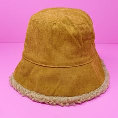 Corduroy bucket hat with fuzzy sherpa fabric on the other side that is reversible. Comfortable to wear and not stuffy. Feel cozy and stylish! Dimensions: approximately 13” x 13” x 6” One size 100% Polyester Made in China Camping Hat, Corduroy Bucket Hat, Crochet Sun Hat, Sherpa Fabric, Reversible Bucket Hat, Crochet Bucket Hat, Knit Alpaca, Casual Hat, Resort Collection