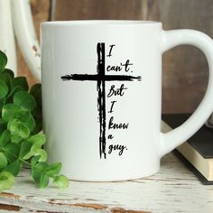 a white coffee mug with a cross on it