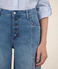 Cropped at the ankles for a fresh look, these flared wide-leg jeans feature sleek seam details, exposed front buttons and Fab Ab front pockets that comfortably shape and smooth in a super soft denim fabric. Fabric: 93% Cotton, 6% Polyester, 1% Spandex Size & Fit: Inseam: 29 1/4", Leg Opening: 23 1/2", Rise: 10 1/2" Color: LIGHTINING W/MED BASE WASH Styled with: Analeah Classic Cotton Shirt (KT133801) Mid-rise Medium Wash Wide Leg Pants With Five Pockets, Medium Wash Wide Leg Jeans With Seam Detailing, Mid-rise Denim Bottoms With Button Closure, Wide-leg Cotton Jeans With Button Closure, Relaxed Fit Wide-leg Jeans With Button Closure, Corduroy Coat, Boyfriend Shorts, Fresh Look, Linen Shorts