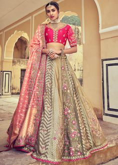 Woven zari Banarasi silk lehenga choli in Beige and Pink 6001 Desc:  Style : A-Line Lehenga Choli Color : Beige and Pink Fabric : Silk   Work : Heavy Jacquard Woven With Embroidery & Stone Work Wash Care : Dry clean Sleeve Style : Half Sleeve Long Sleeves : Done only in Custom Stitch Sleeves Lining : Done only in Custom Stitch Bust Size : 32 to 42 Inches Occasion : Wedding   Mehendi   Sangeet   Engagement   Reception   Ceremonial   Baby ShowerShop Banarasi lehenga,silk lehengas,hea Red Bride, Tulle Shawl, Silk Lehenga Choli, Bridesmaid Lehenga, Raw Silk Lehenga, Lehenga Red, Modest Evening Dress, Pretty Skirts, Embroidered Lehenga