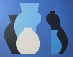 two vases on a blue background with one black and one white in the foreground