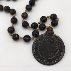 Vtg Oversized Handmade Ancient Pendant Necklace Black Spiritual Necklace With Coin Pendant, Black Amulet Necklace With Coin Pendant, Black Necklace With Oxidized Finish, Vintage Black Long Necklace, Unique Black Necklace With Large Pendant, Black Artisan Round Necklace, Vintage Black Handmade Beaded Necklaces, Artisan Black Necklace With Oxidized Finish, Artisan Black Round Necklace