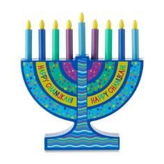 a blue menorah with lit candles on it