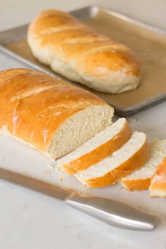 a loaf of bread sitting on top of a cutting board