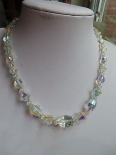 "1950's Single Strand Almond shaped faceted glass Aurora Borealis necklace, the necklace is 16\" long with a foiled back rhinestone flower box fastener. This necklace is in a good condition. (31/7A)" Aurora Goddess, Crystal Goddess, Necklace Flower, Peruvian Opal, Necklace Chunky, The Necklace, Almond Shaped, Rhinestone Flower, Flower Box