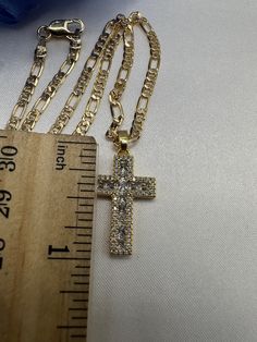 Cross pedant with 18 inch chain. Crystal Cross Jewelry With Adjustable Chain, Crystal Cross Chain Jewelry, Crystal Cross Jewelry With Chain, Crystal Cross Necklace With Adjustable Chain, Gold Crystal Rhinestone Cross Pendant Necklace, Crystal Clavicle Chain With Cross Pendant, Crystal Cross Pendant Clavicle Chain, Crystal Cross Pendant Clavicle Necklace, Rhinestone Cross Necklace With Adjustable Chain As Gift