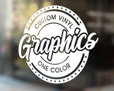 the logo for graphic's one color window sticker on a store front door