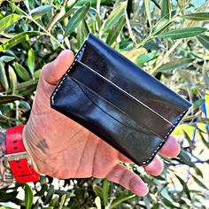 Slim cardholder, minimalist wallet, and handmade wallet enthusiasts will love our Black Leather Card Holder. This stylish and functional black leather wallet is expertly stitched for longevity, blending elegance and practicality. Proudly made in the USA, it makes a thoughtful gift for women and men alike. Whether you're looking for a black leather wallet that fits easily in your pocket or a personalized leather cardholder, this small leather wallet is the perfect choice. Perfect Size: Measuring Minimalist Black Rectangular Card Holder, Black Minimalist Trifold Wallet For Everyday Use, Minimalist Black Wallet With Coin Pocket, Black Minimalist Trifold Wallet, Black Minimalist Card Holder With Coin Pocket, Minimalist Black Leather Card Holder, Minimalist Black Trifold Wallet For Daily Use, Minimalist Black Bifold Wallet, Black Minimalist Card Holder