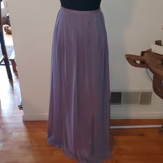 This Beautiful Breath Taking Light Purple Maxi Skirt Has Never Been Worn It Still Has Tags Attached. It Sells Its Self It Beautiful Breathable Lightweight Fun Chic And Sexy All In One Elegant Fitted Lavender Skirt, Elegant Fitted Lavender Bottoms, Purple Lined Skirt For Evening, Elegant Lavender Skirt For Party, Formal Flowy Skirt With Elastic Waistband, Elegant Full Skirt In Purple, Elegant Purple Full Skirt Bottoms, Elegant Full Purple Skirt, Elegant Purple Pleated Maxi Skirt