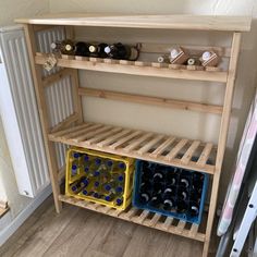 a wooden shelf filled with wine bottles next to a radiator