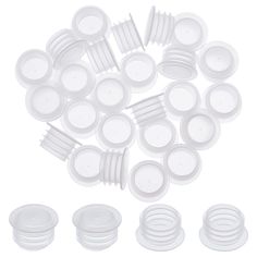 a pile of white plastic plates and lids on a white background with clippings