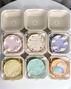 six compartments with different types of cookies in them on a white table top next to each other