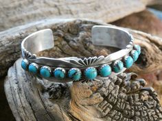 This is a beautiful Handcrafted Native American Made Sterling Silver Turquoise Gemstone Bracelet Cuff. The cuff is entirely Handcrafted which makes it a ONE OF A KIND. You get the EXACT bracelet shown. (It will come Gift Boxed) This piece is stamped Sterling and also has the name of the Native American artist silversmith. P Yazzie (Patrick Yazzie) is known for his Native American works of art.  With it's beautiful Turquoise and it's Oxidized Sterling Silver and Hand Stamped Native American design this unique bracelet would make a great gift or add it to your collection! It can be for a man or woman. In the Native American culture it is believed that Turquoise jewelry is a symbol of protection, truth, and courage. It is also believed to have the power to repel negativity energy and deflect Native American Words, Native American Design, Native American Artists, American Culture, Unisex Bracelets, Bracelet Cuff, Unique Bracelets, Oxidized Sterling Silver, American Design