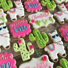 decorated cookies are arranged on a table