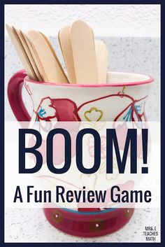 a cup with spoons in it and the words boom on top