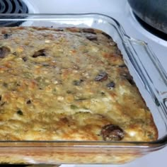 a casserole dish sitting on top of a stove