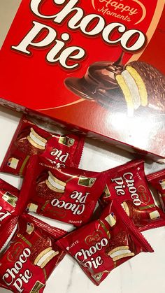 a box of chocolate pies sitting on top of a counter next to it's wrapper