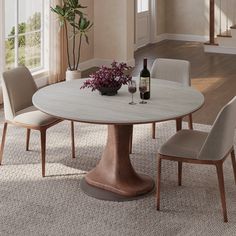 a dining room table with chairs and a wine bottle