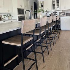 a kitchen filled with lots of counter top space next to an oven and refrigerator freezer