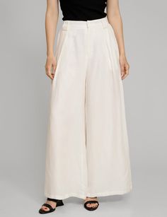 White linen wide leg pants . Styled with matching oversized vest . 70% tencel, 30% tencelFully lined Side pockets Back elastic waist Wide leg Size s waist is 26-27", hips 38"Size m waist is 28-29", hips 40"Model wears size S and is 5.8"/ 1.70 cmImported White Linen Wide Leg Pants, White Relaxed Fit Wide-leg Pants, Wide Leg White Linen Pants, White Linen Wide-leg Bottoms, White Mid-rise Wide Leg Pants With Pockets, Mid-rise White Wide Leg Pants With Pockets, Cream Wide-leg Linen Bottoms, Linen Wide Leg Pants, Oversized Vest