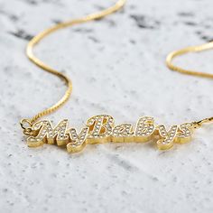 Every stylish woman should have a Custom Nameplate Necklace in their jewelry box. Not only do they look fashionable, but they look gorgeous on their own or layered up. This particular style features a font that is easy to read and that has a beautiful flow to it. The colors are all neutral metallics, which makes them very versatile. All of our name necklaces have a polished surface so that they gleam beautifully in the light. If you are on the hunt for a thoughtful gift for a loved one, this wou Trendy Name Necklace For Mother's Day, Trendy Nameplate Necklace, Trendy Rose Gold Necklace For Mother's Day, Customized Trendy Gold Necklaces, Trendy Customized Gold Necklaces, Trendy Gold Name Necklace With Clavicle Chain, Trendy Gold Clavicle Chain Name Necklace, Trendy Gold Name Necklace With Adjustable Chain, Trendy Gold Name Necklace