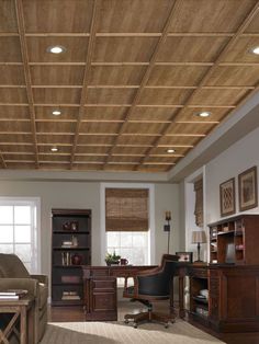 a living room filled with furniture and a wooden ceiling