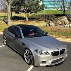 a silver car parked in a parking lot