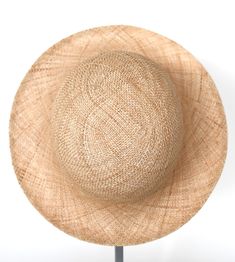 "\"Pina\" is a light summer sun hat with a wide flared brim. The shapely curve of the brim ensures a perfect fit and underlines a clear, feminine look. The material \"Bao\" made of the undyed fibres of the baobab tree is pleasantly permeable to air and ensures maximum wearing comfort. Available in sizes 55 cm - 60 cm. Colour \"nature\" Hat of \"Bao\" - Monkey bread tree Grosgrain ribbon (inside) made of 66% cotton and 34% polyamide Handmade Individualization options Other colours or sizes on req Lightweight Short Brim Sun Hat For Kentucky Derby, Chic Cloche Sun Hat For Vacation, Kentucky Derby Lightweight Short Brim Sun Hat, Elegant Lightweight Brimmed Straw Hat, Chic Straw Cloche Hat With Short Brim, Elegant Lightweight Sun Hat For Spring, Flat Brim Panama Hat For Garden Party, Flat Brim Toquilla Straw Hat For Garden Party, Bohemian Natural Boater Hat For Kentucky Derby