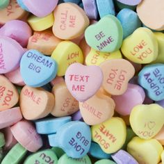 conversation hearts with the words dream, text me, and smile on them for $ 5