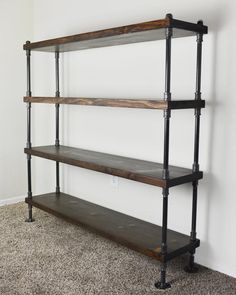 an industrial style shelving unit with three shelves on each side and one shelf below