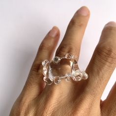 "Welcome to Hidden Glass Atelier! Glad you have found me  ✦ DESIGN    ✧ Simple and elegant band with waves like deco, handmade with clear transparent Murano glass.    ✧ Two styles: chunky and dainty to choose from    ✧ Styling: It is chic to wear alone, or stack with other metal rings for an interesting mix of material look and a pop of color. It is easy to wear up or down with a casual outfit or for a special occasion.  There is a similar style of earrings you could find it here: https://hiddenglassatelier.etsy.com/listing/1598972468    ✧ Durability: All the glass jewelry pieces are tempered by a professional kiln to provide maximum durability.    ✧ Origin: This one-of-a-kind glass ring will be custom handmade for you by me from Murano Venice Italy - the very heart of glass art since the Modern Resin Rings For Gifts, Unique Clear Crystal Ring For Gift, Unique Clear Crystal Ring As A Gift, Unique Clear Resin Ring, Unique Clear Resin Rings, Adjustable Clear Rings, Unique Resin Crystal Ring Gift, Adjustable Clear Jewelry For Party, Handmade Clear Rings For Gifts