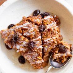 a white bowl filled with granola and raisins