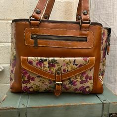 Patricia Nash Antique Rose And Brown Leather In Excellent Pre Loved Condition. Double Handles, Interior Is Clean Full Lined Dimensions: H:12” W:16.5” D:3” Brown Leather Bag, Antique Roses, Womens Tote Bags, Leather Bag, Brown Leather, Handles, Floral, Leather, Pink