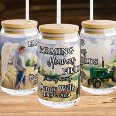 three glass jars with farm scenes on them