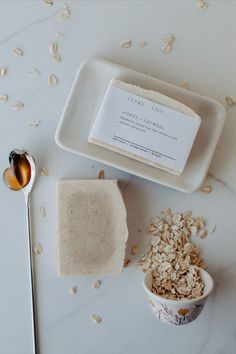 a spoon and some food on a white table with a label that says the body