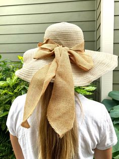 "Floppy straw beach hat with natural linen ribbon and bow. Summer straw hat is perfect for wearing to the beach, a picnic, out and about in town on a warm, sunny day! Natural linen bow Grosgrain ribbon interior headband Brim size - 5 1/4\" Full diameter - 18\" Head size - 21\" Wire in brim edge for shaping Sun n' Sand Headwear Condition is very good." Adjustable Natural Sun Hat For Garden Party, Beige Summer Panama Hat For Picnics, Summer Jute Sun Hat For Beach Season, Natural Hat For Beach Season Picnic, Natural Hats For Picnic During Beach Season, Natural Hat For Picnic And Beach Season, Natural Color Hats For Beach Picnic, Beige Summer Sun Hat For Picnic, Jute Sun Hat For Beach And Spring