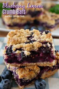 blueberry crumb bars stacked on top of each other