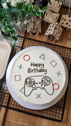 a birthday cake with a video game controller on it